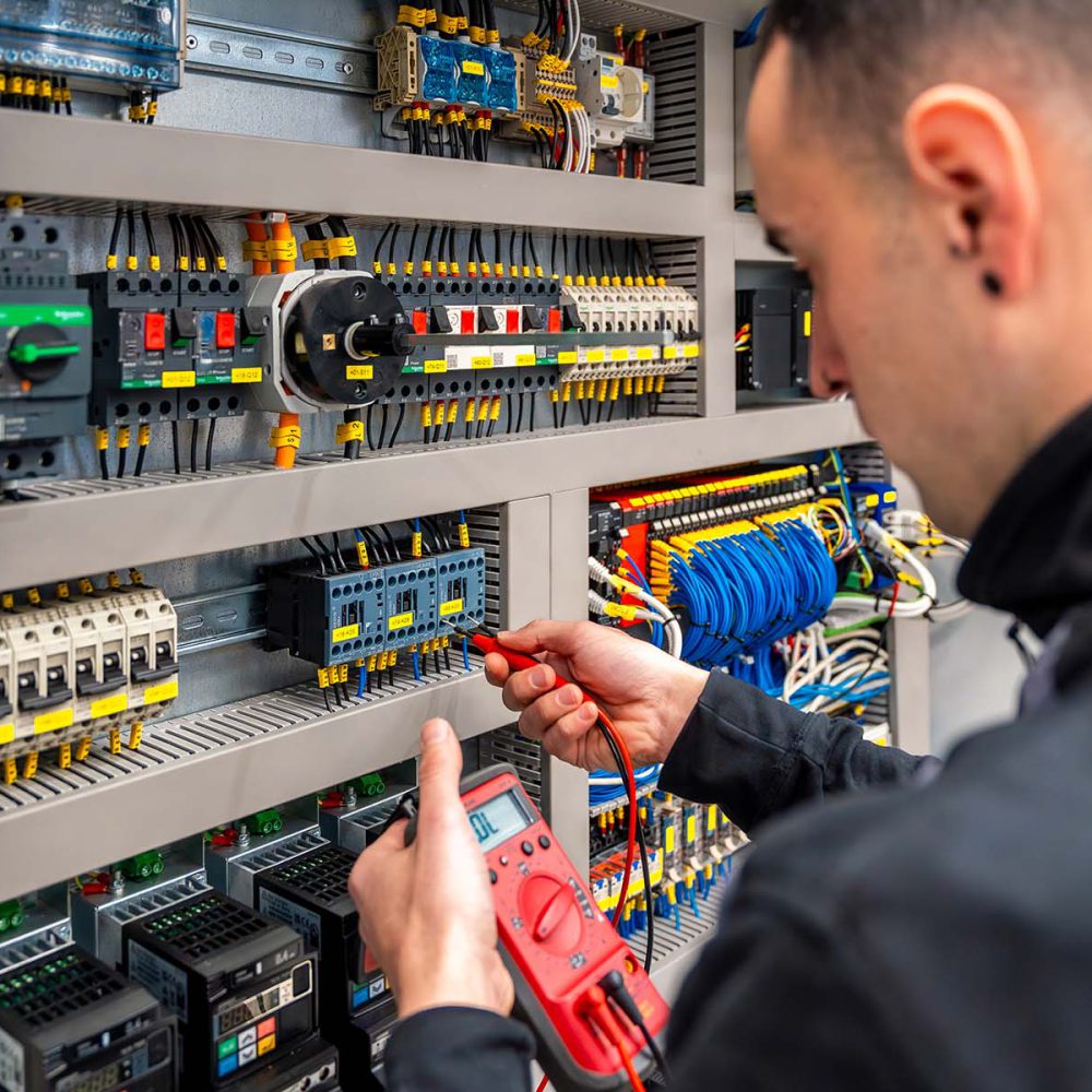 close-up-of-an-engineer-repairing-an-electrical-sy-SWKE5HU.jpg
